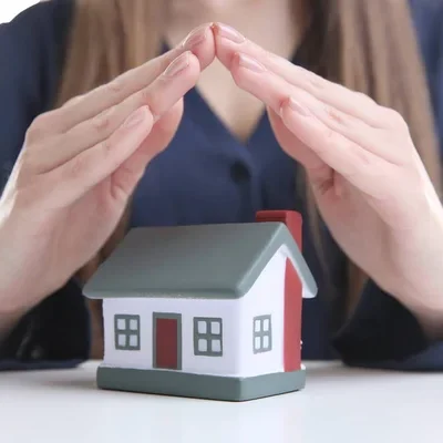 depositphotos_147503219-stock-photo-hands-over-model-of-house